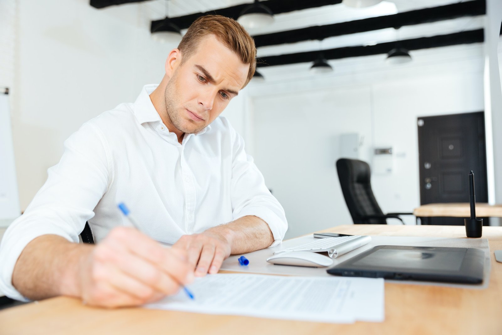 Creating A Successful Blog For Your eCommerce businessman sitting in office and writing