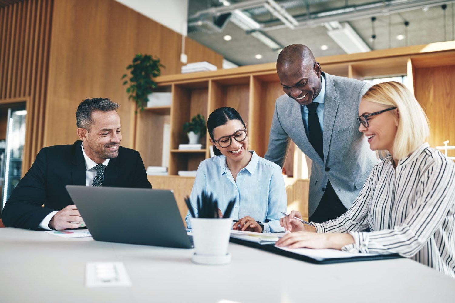 Creating an Effective Social Media Marketing Campaign diverse group of businesspeople laughing together during an office meeting e1669187877235